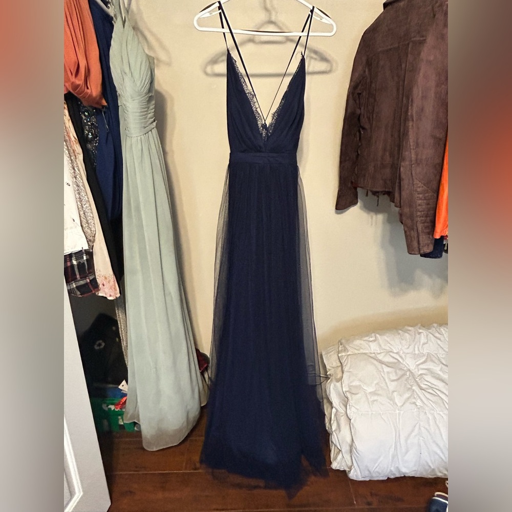 Never worn, bought for a photo shoot never ended up wearing it. Brand new